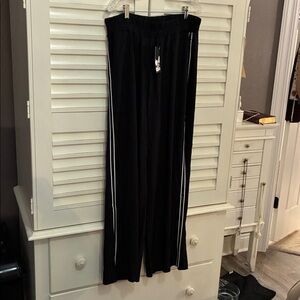 Chic Black ladies pants, inseam is 29.5. High waisted. Splits on the side.